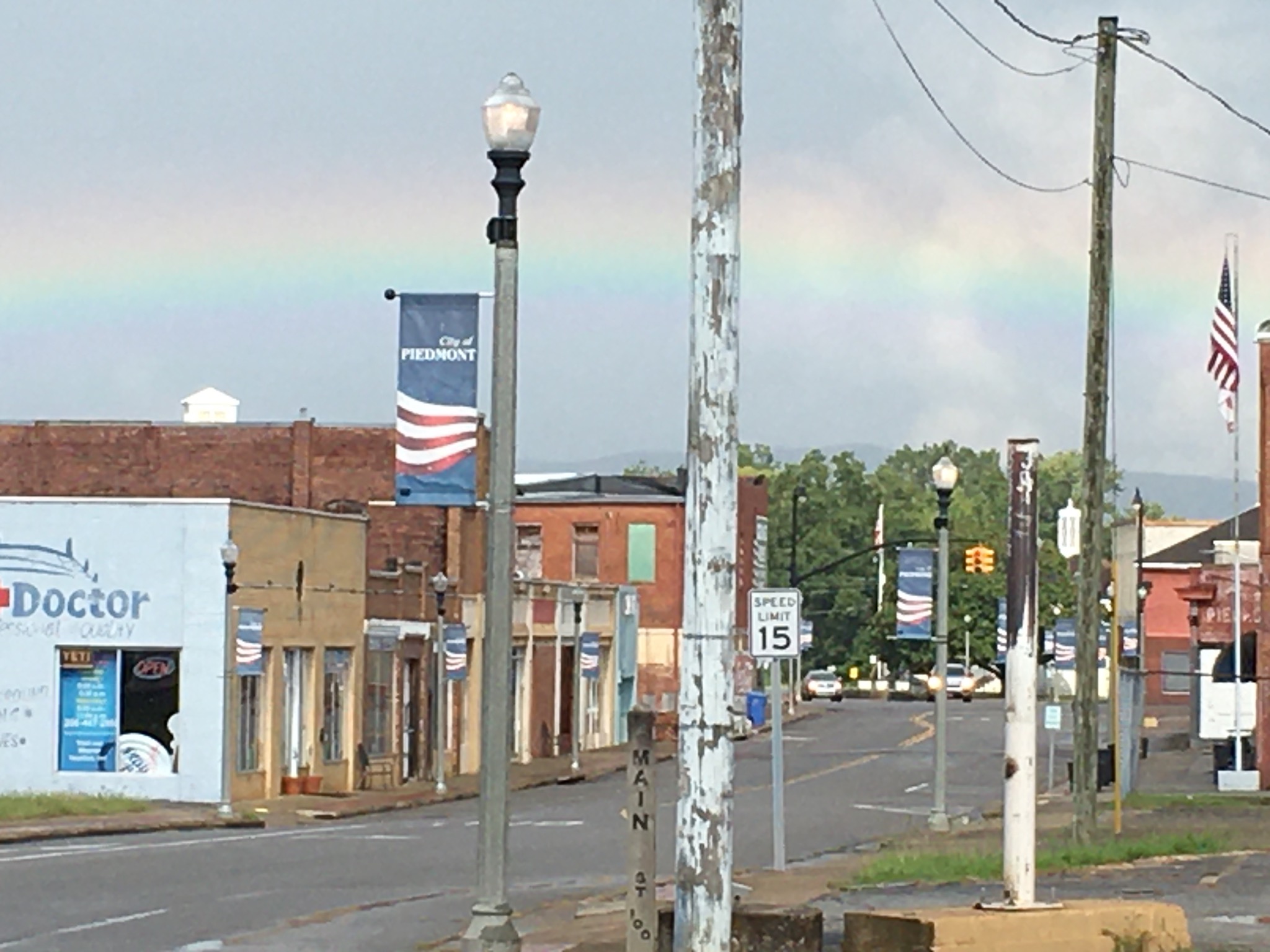 Rainbow stretching over Main Street in downtown Piedmont, Alabama.